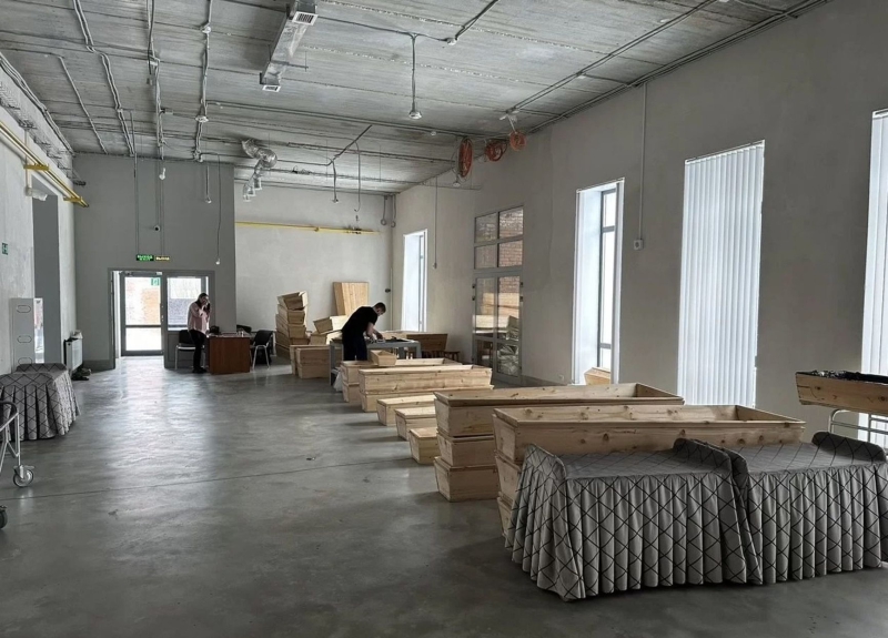 Cardboard coffins and countertop monuments: Russia is increasingly cutting costs on the burial of its war dead